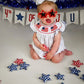 Baby Girl 4th of July Romper – Smocked Bubble Bodysuit with American Flag Embroidery